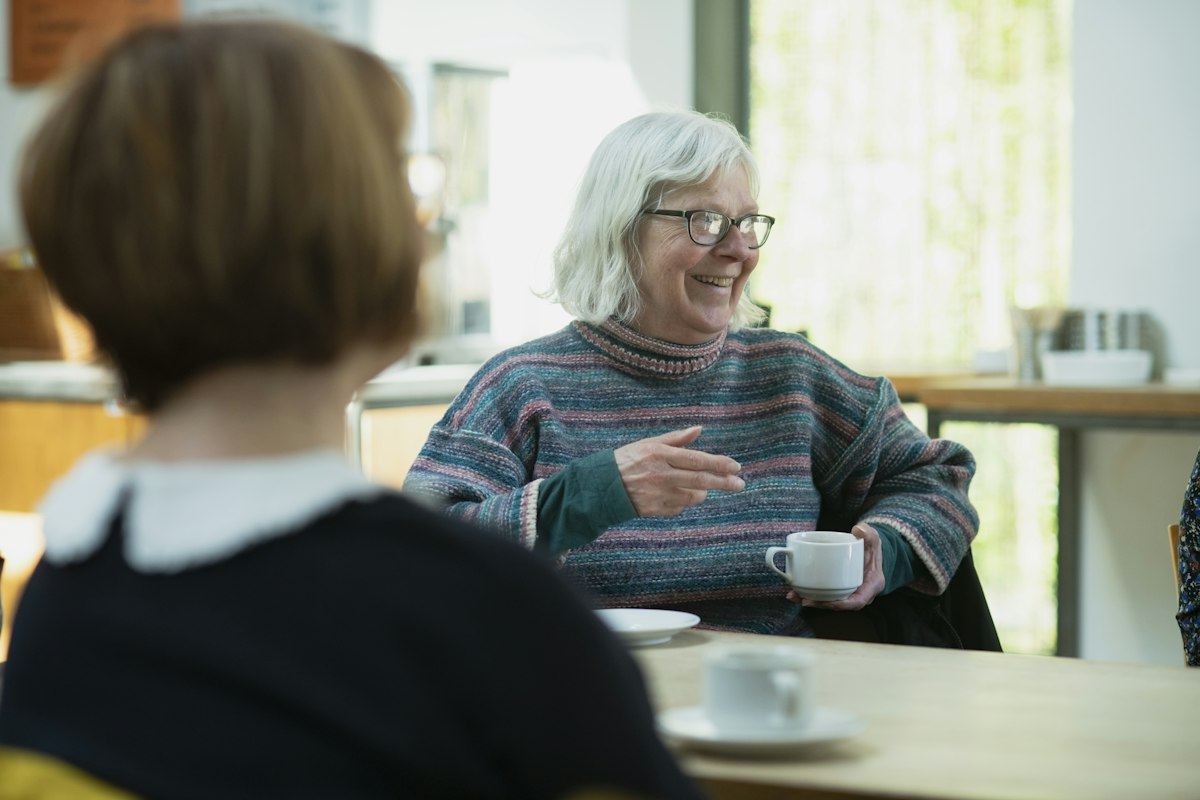 Adult child talking with an aging parent about senior living options near Elgin, Illinois