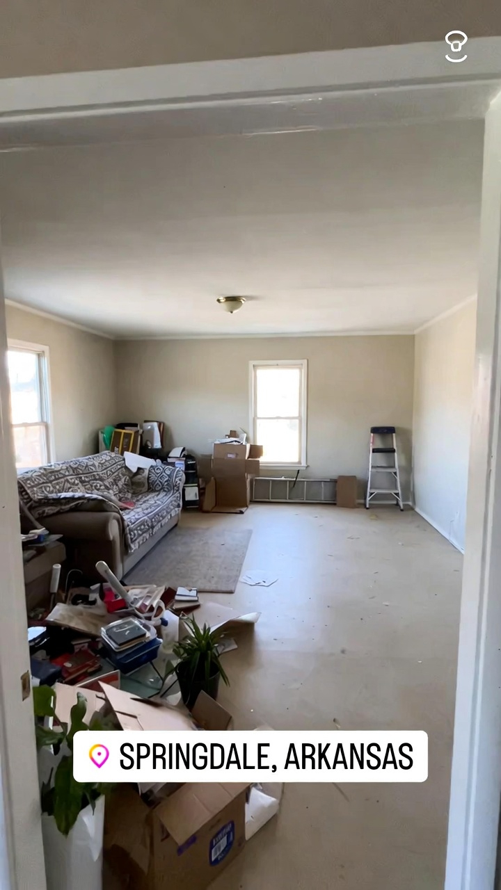 Cluttered living room before junk removal service in Springdale, AR