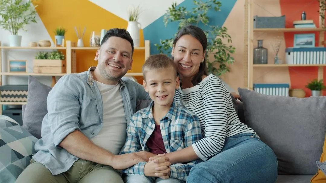 VA refinance veteran family in front of their home