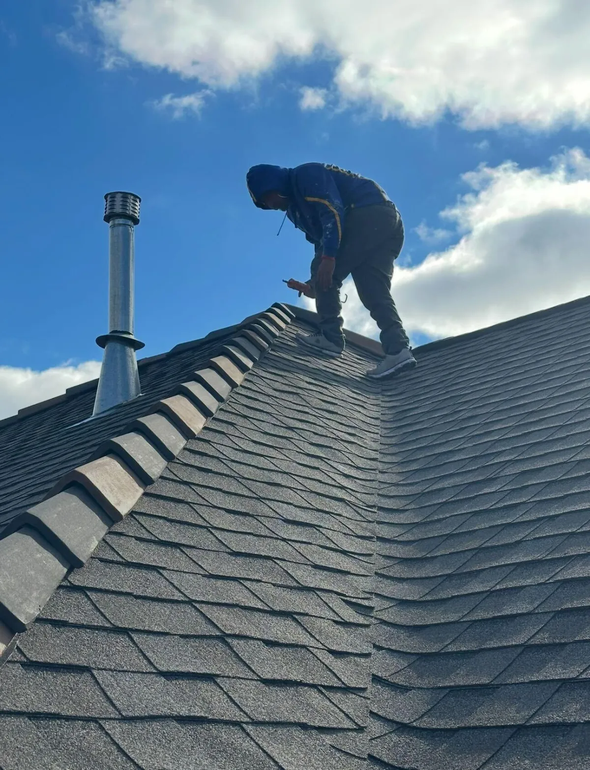 a man riding a skateboard on top of a roof