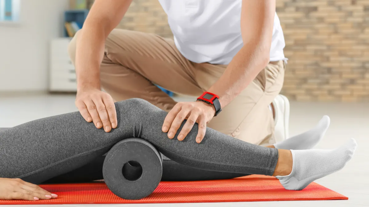 woman in black tank top sitting on brown wooden dock during daytime