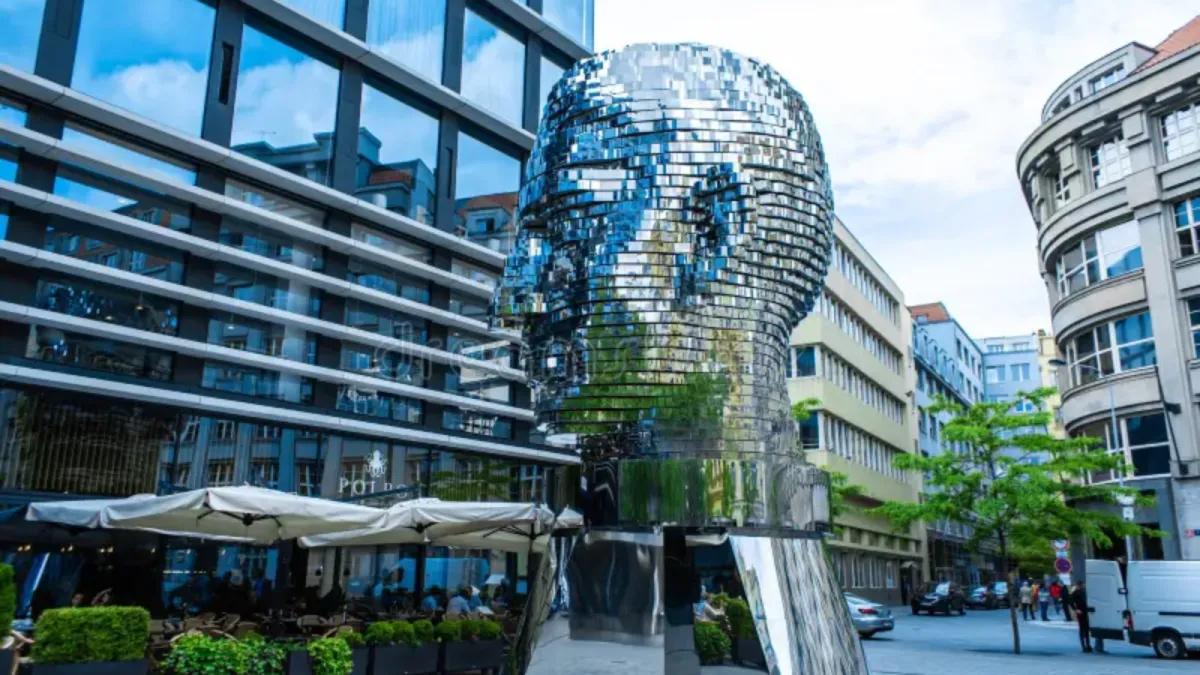 a statue of a person holding a cross