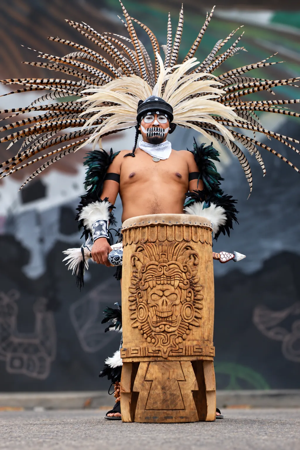 Traditional Danza Mexika regalia in warm amber tones