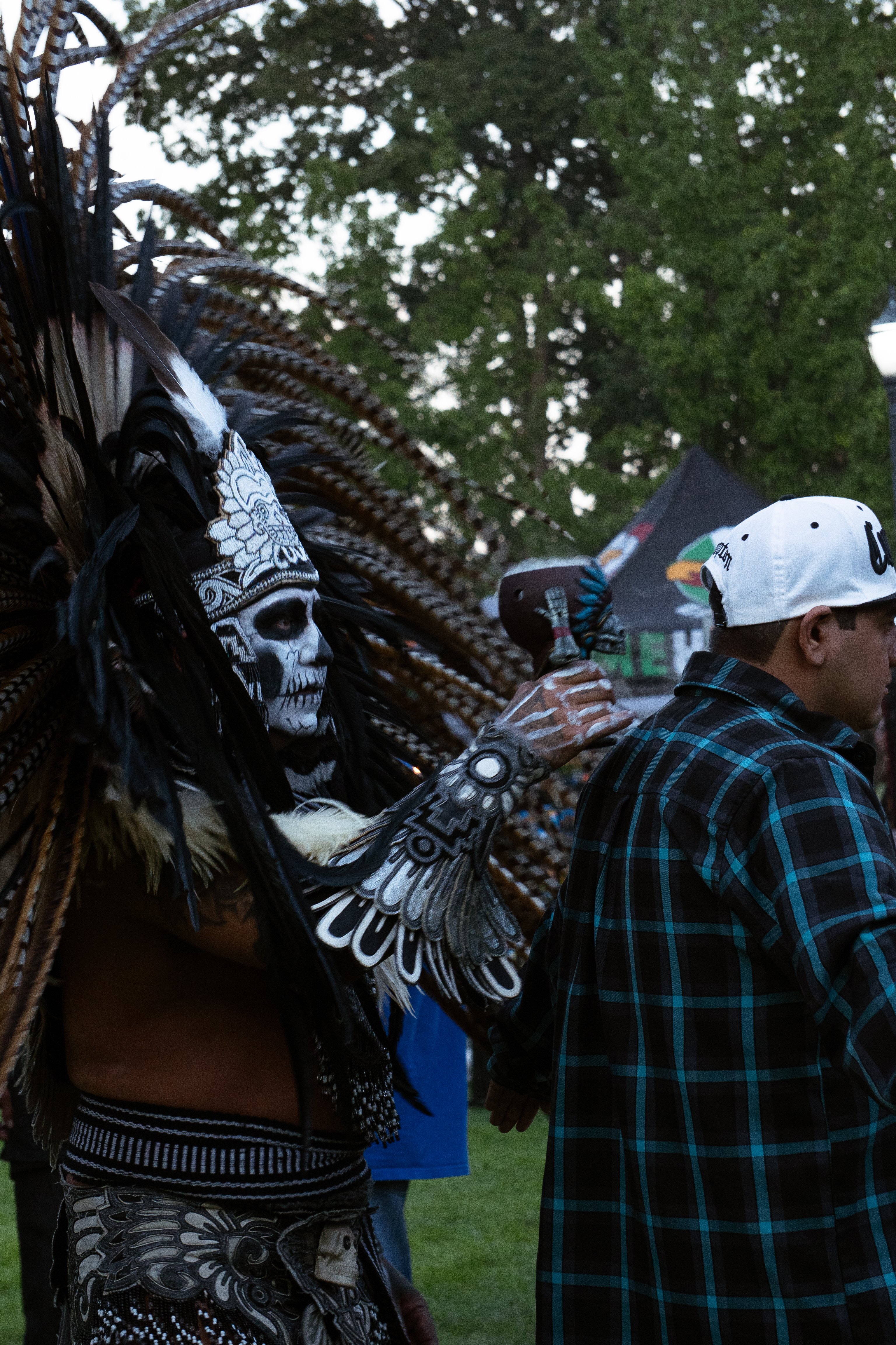 High-contrast photography of a Danza Mexika dancer mid-stride
