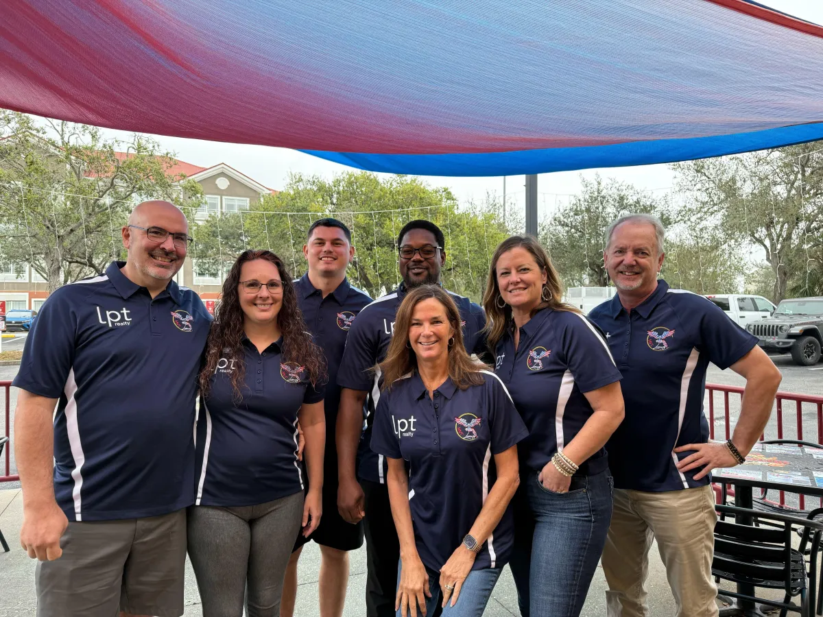 a private property sign hanging on a chain link fence