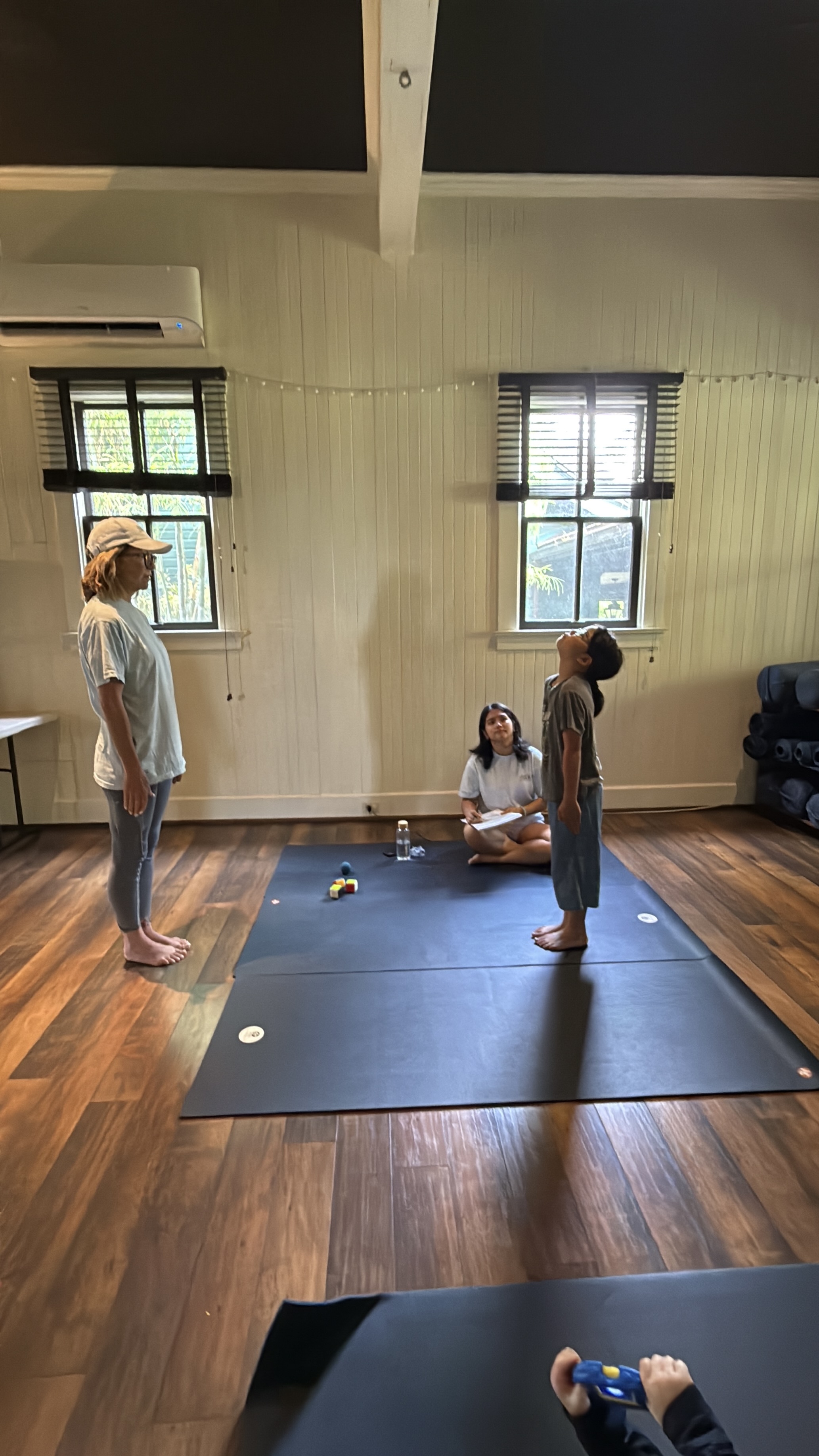 Teacher supporting young child in a calm classroom setting