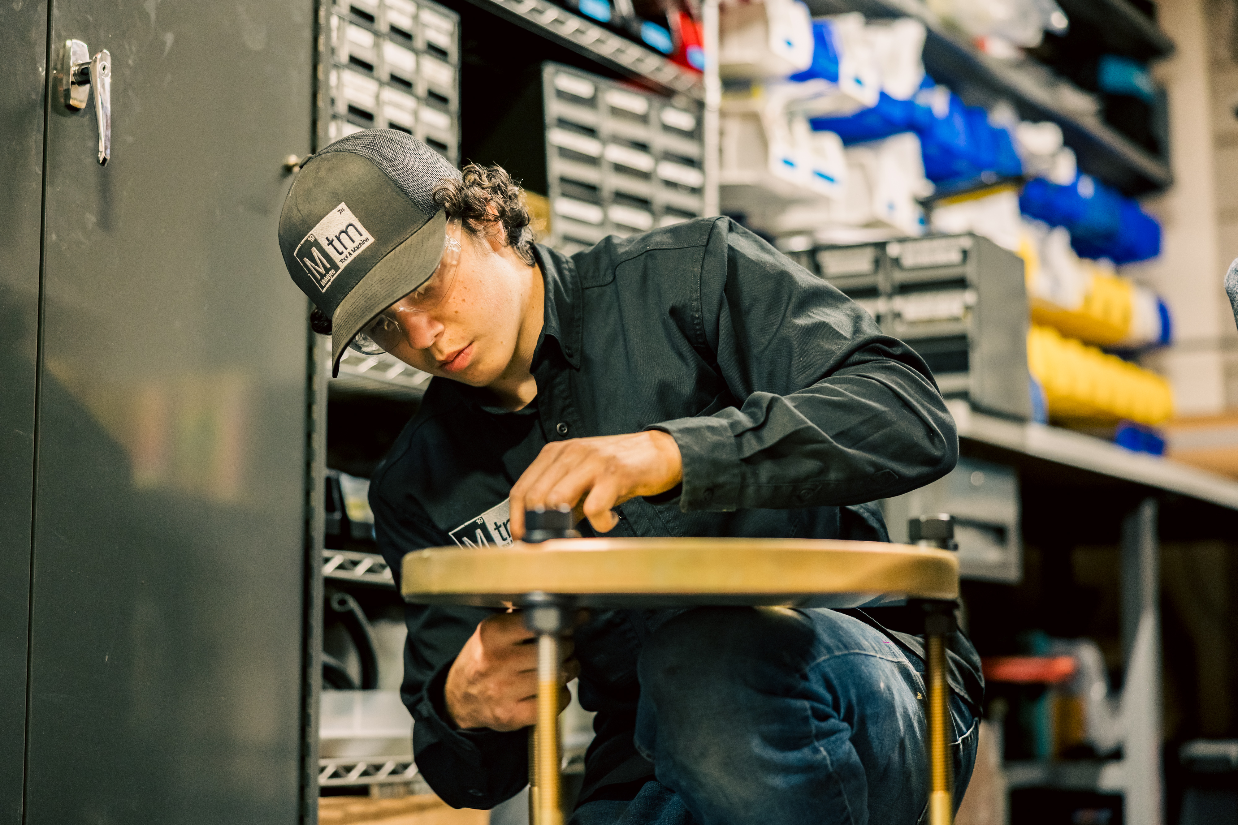 Assembling and inspecting precision tooling components in the MTM production department.