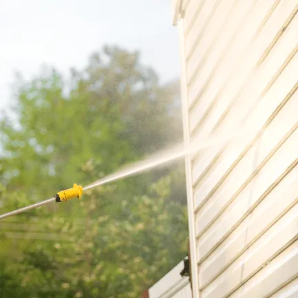 Effective pressure washing removing dirt and grime from hard surfaces.