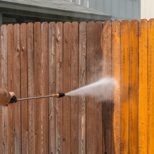 Fence and deck cleaning revitalizing outdoor wooden structures.