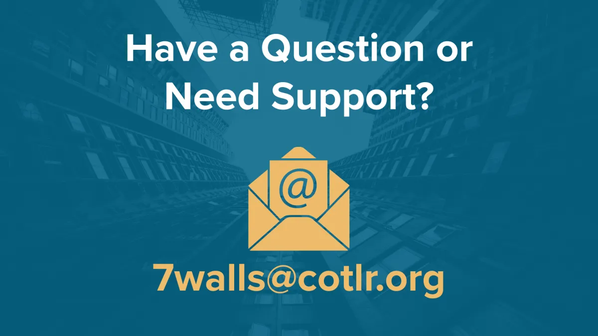 A close-up of two hands, one older and one younger, gently clasped over a table with soft natural light, symbolizing intergenerational support and community care. The background is softly blurred in warm neutral tones.