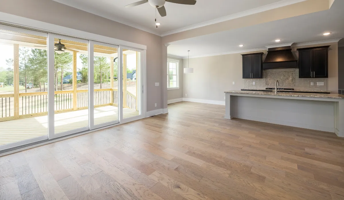 A dancer lies on the floor in a studio.