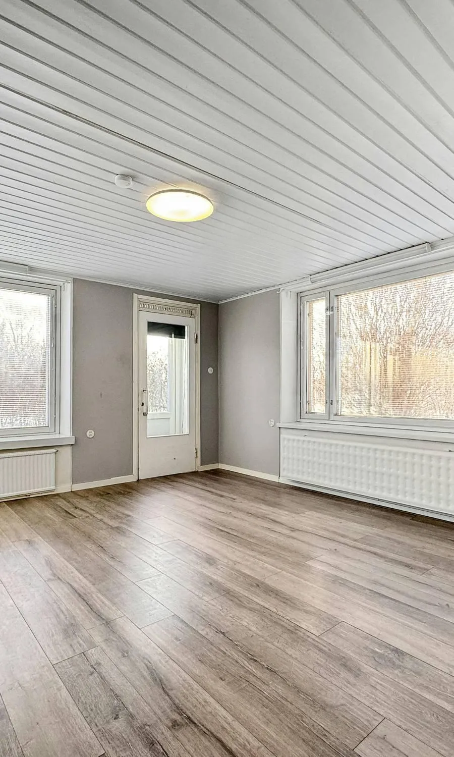 A large room with a checkered floor and mirrors