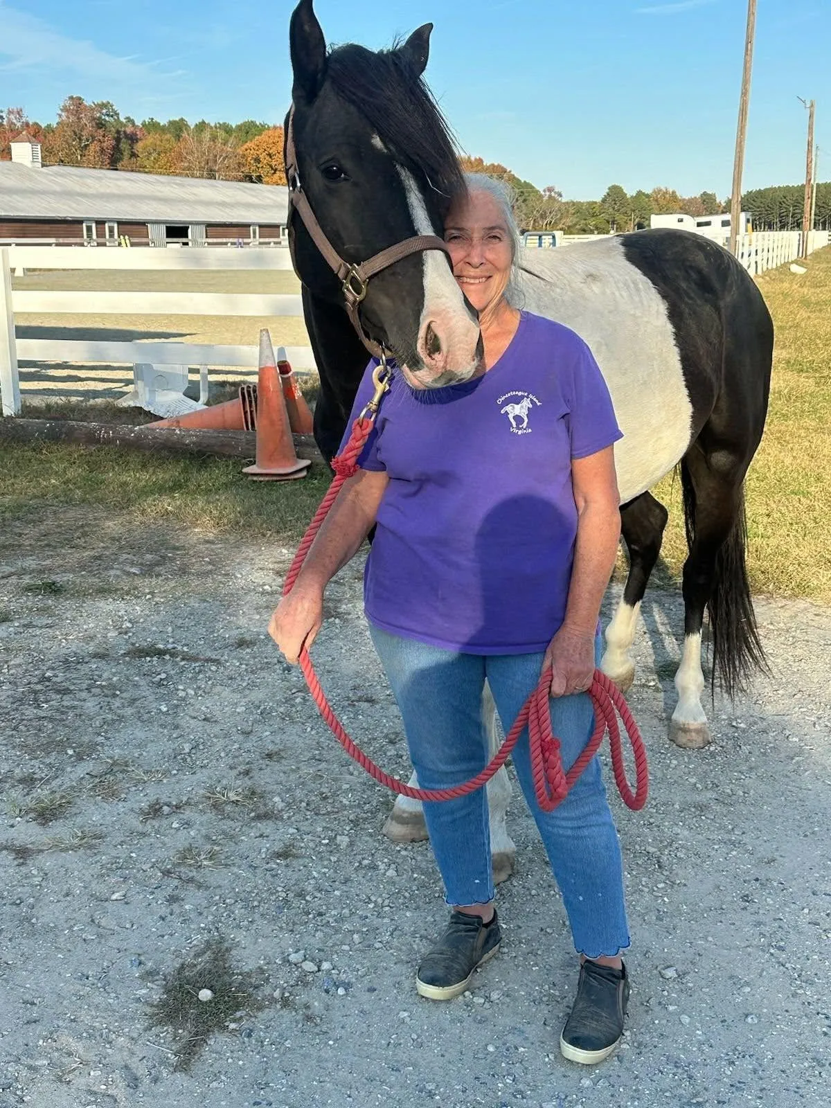 Miles Made Member staning with her horse