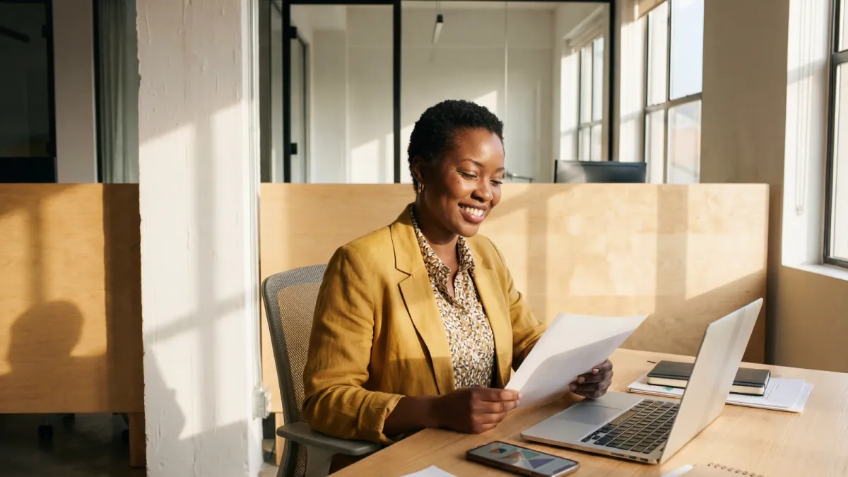 Business card and stamp on a desk
