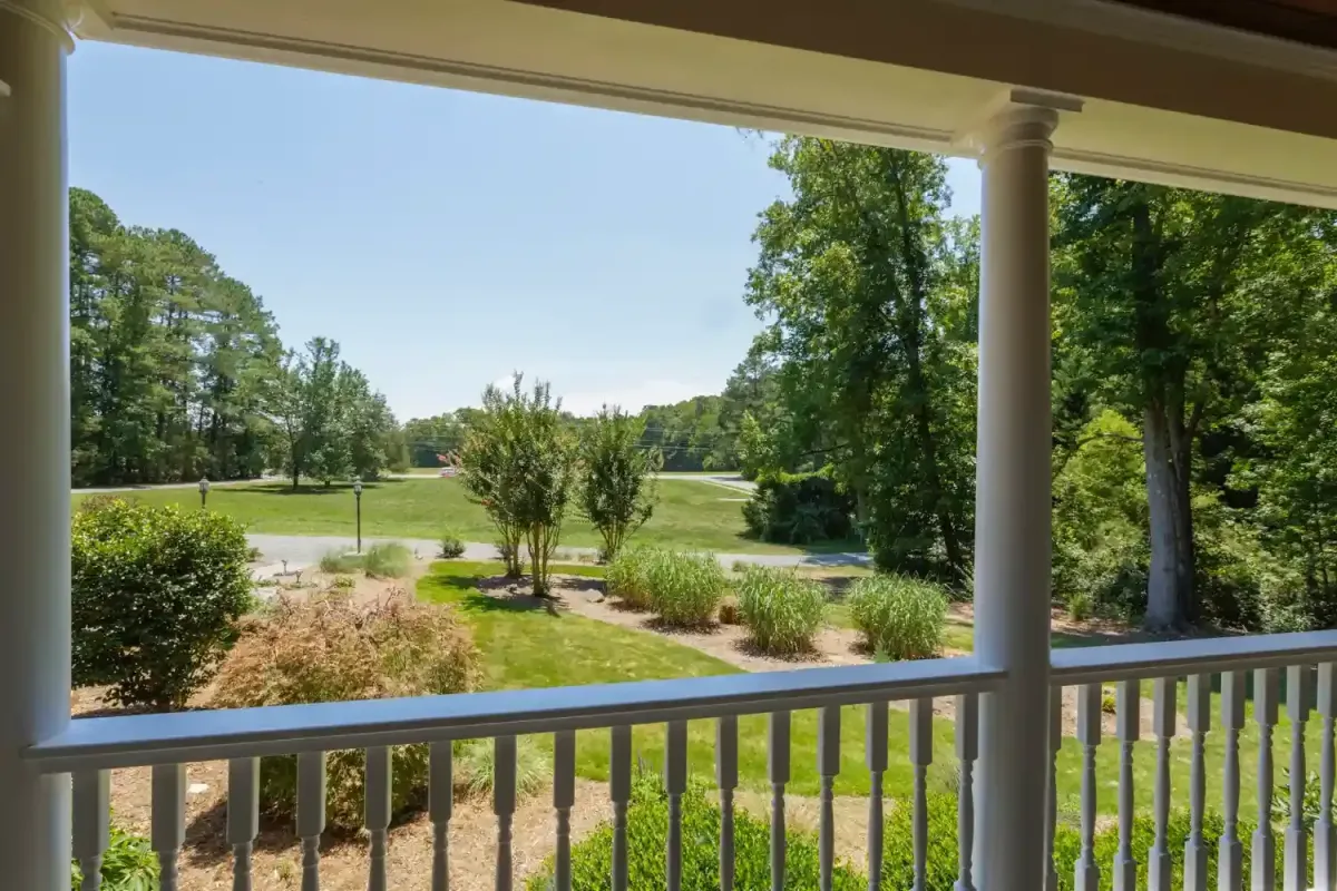 Front porch view Garner NC home generous lot mature trees suburban lifestyle