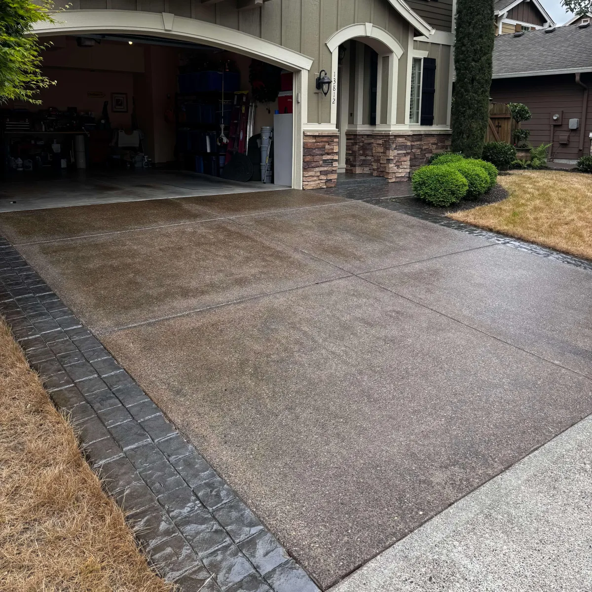 This is an acrylic coated driveway. Acrylic sealing a driveway allows the driveway to maintain that beautiful shiny wet look.