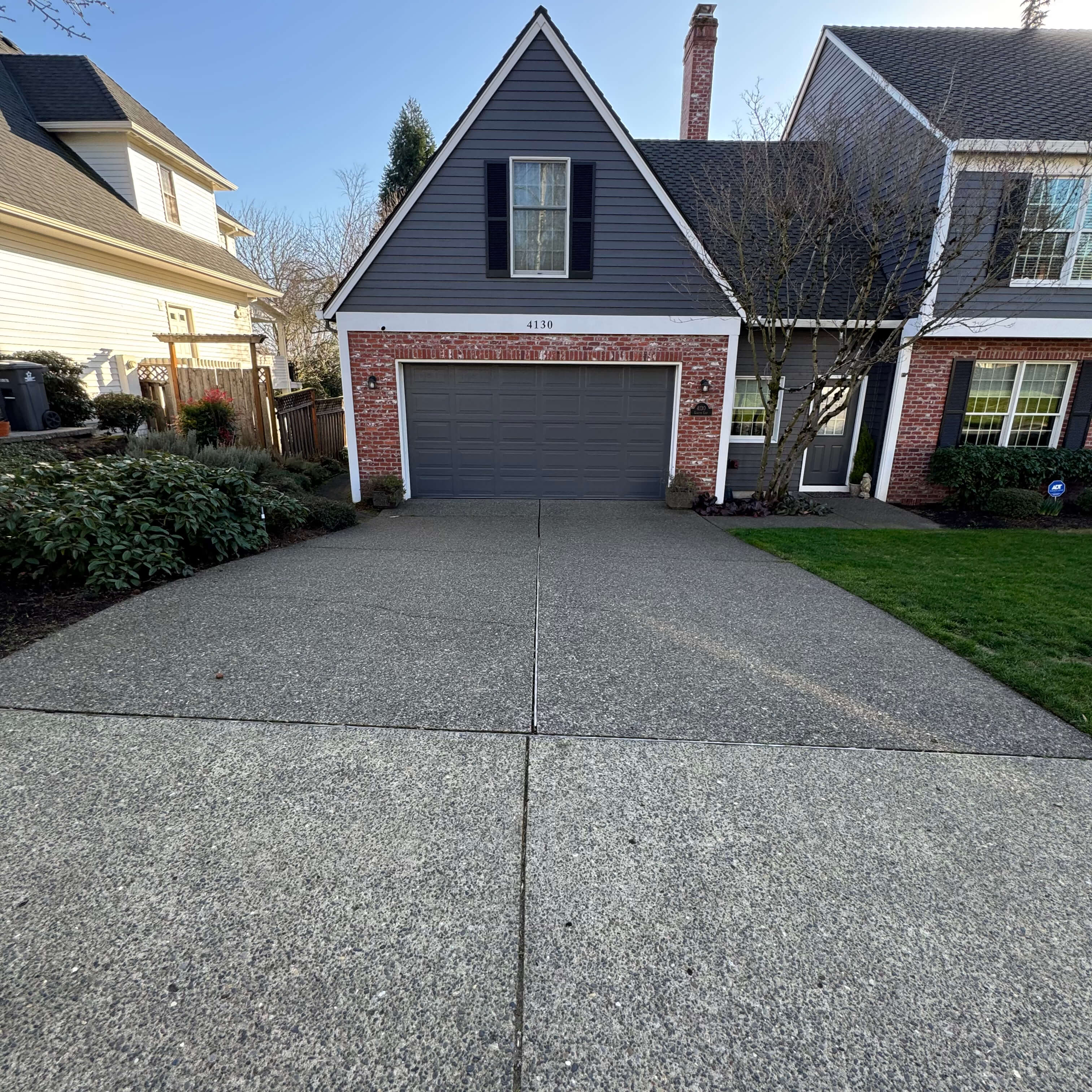 Driveway before and after pressure washing in west linn.