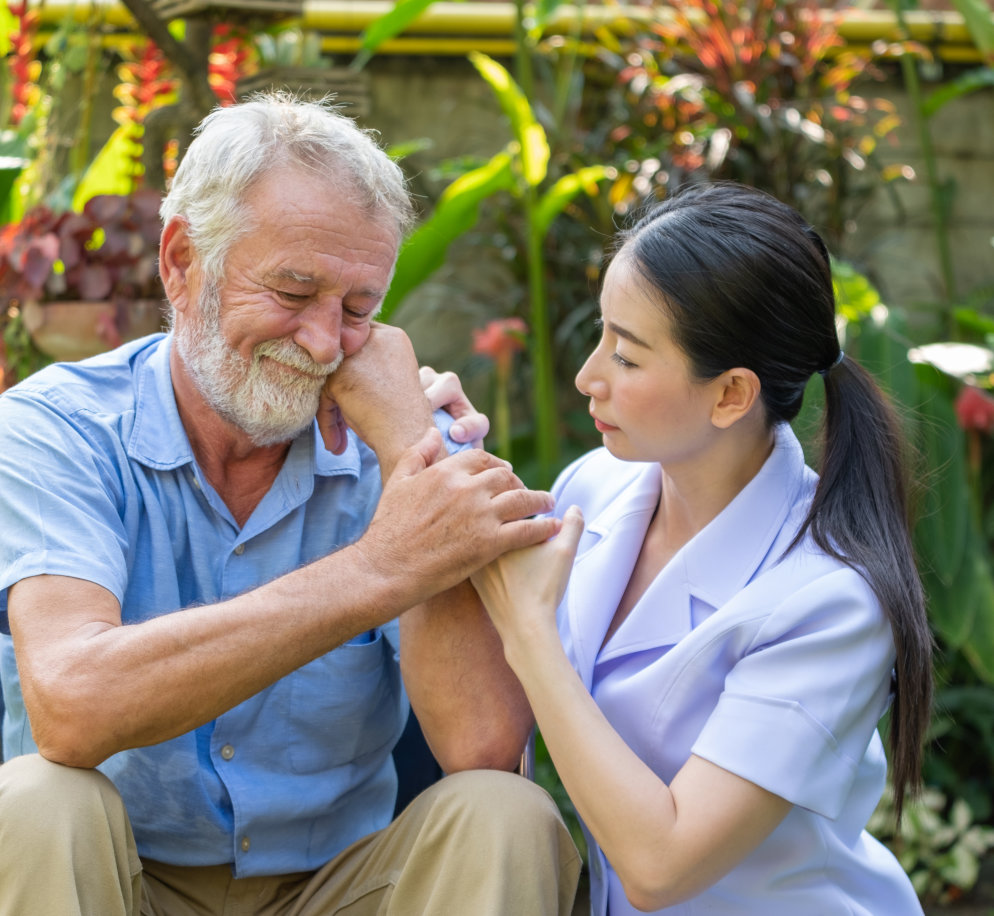 Warm caregiver and senior at home
