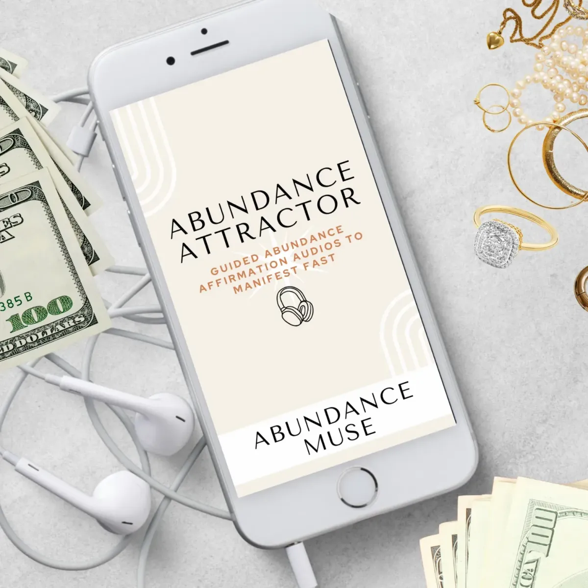 Phone with abundance attractor audio bundle surrounded by money and jewelry