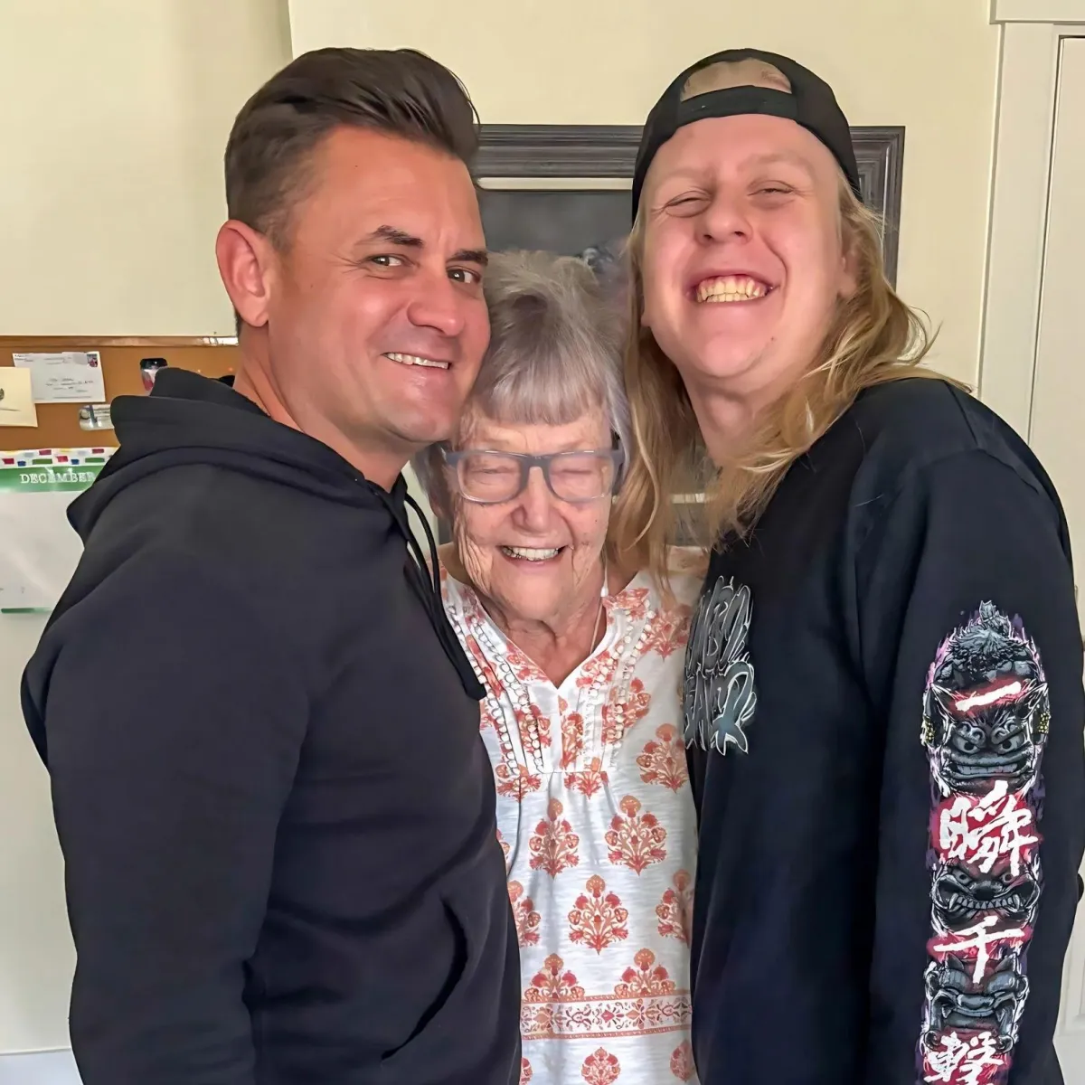 Grandma, son, Grandma, son, and grandson smiling after a proven family coaching session focused on elder care and emotional support strategies. grandson smiling after a proven family coaching session focused on elder care and emotional support strategies.