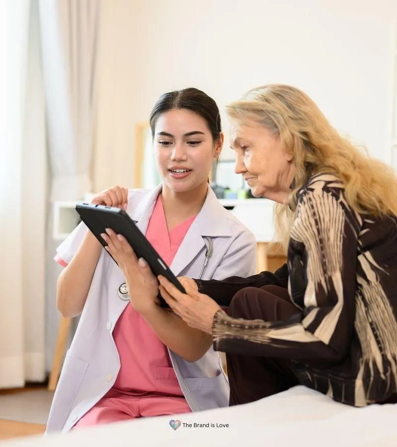 Assisted living facility worker talking to an elder woman, showcasing that the right senior living choice starts with expert guidance.