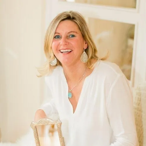 Woman celebrating aligned growth with Abundance Muse manifestation resources