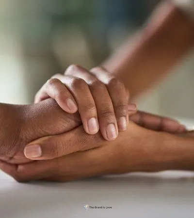 Two people holding hands, showcasing support and connection during the grief and bereavement process.