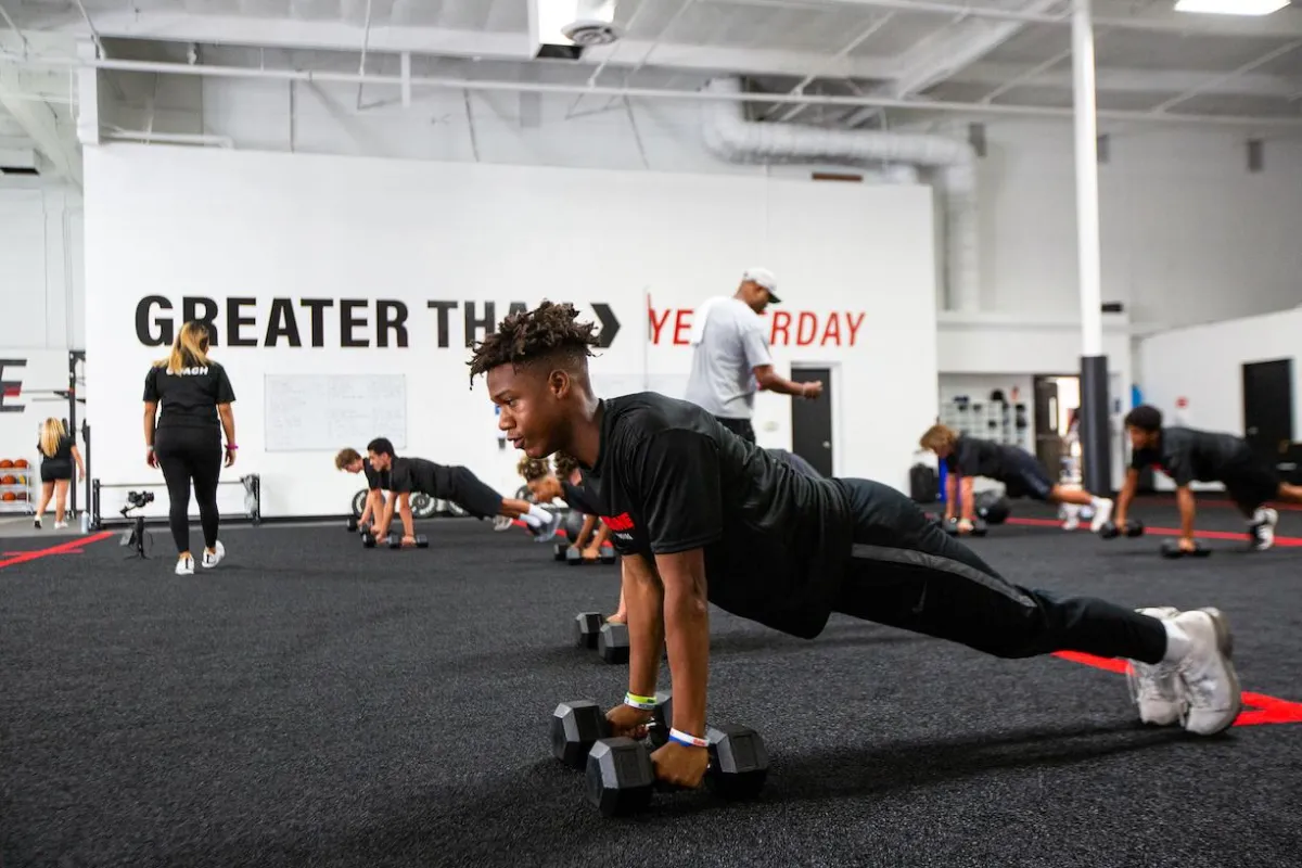 Greater Than Yesterday Training Image Young Man doing push ups