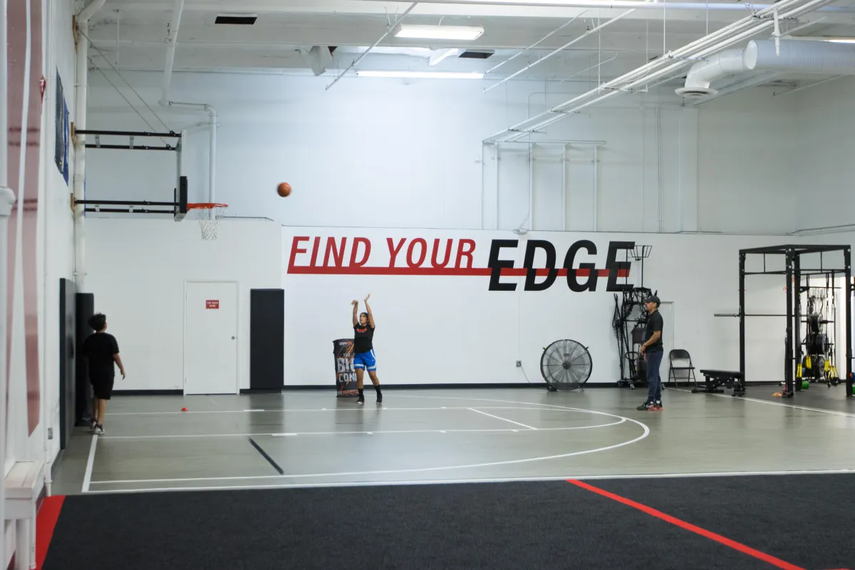 Basketball training image one boy shoots one boy defends