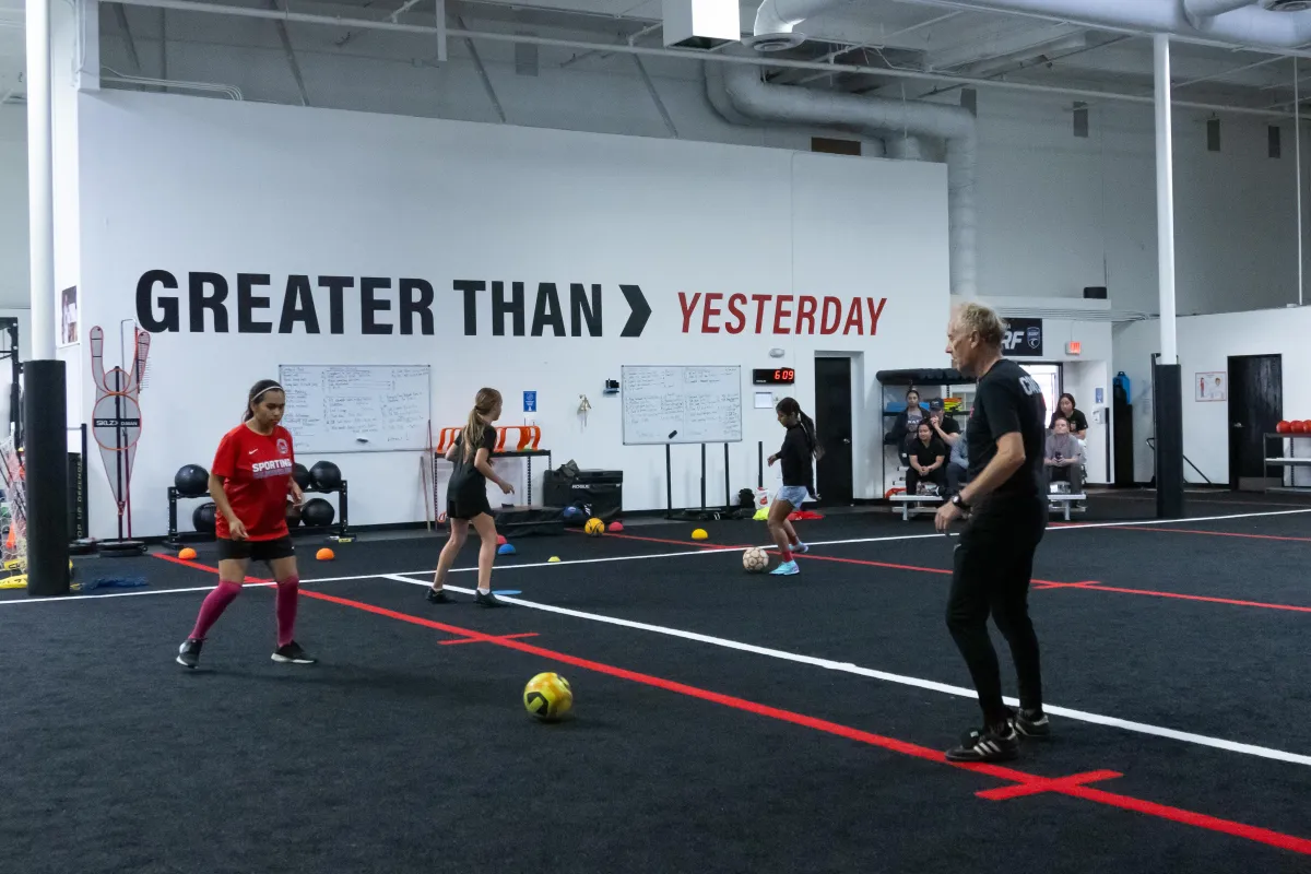 Youth Soccer Training Image One boy shoots basketball one boy defends