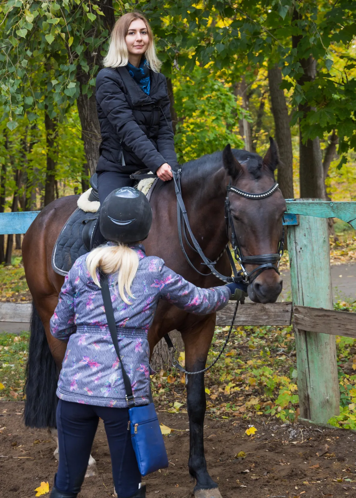 Smiling rider enjoying a peaceful therapeutic horse riding experience at the farm