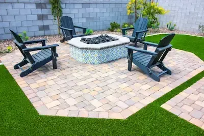 A custom built patio with firepit and space for seating in Lunenburg, MA