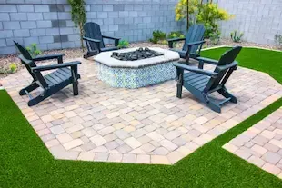 A brand new patio with firepit and seating installed in Westborough, MA