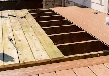 An older deck gets remodeled and repaired to make it look like new again