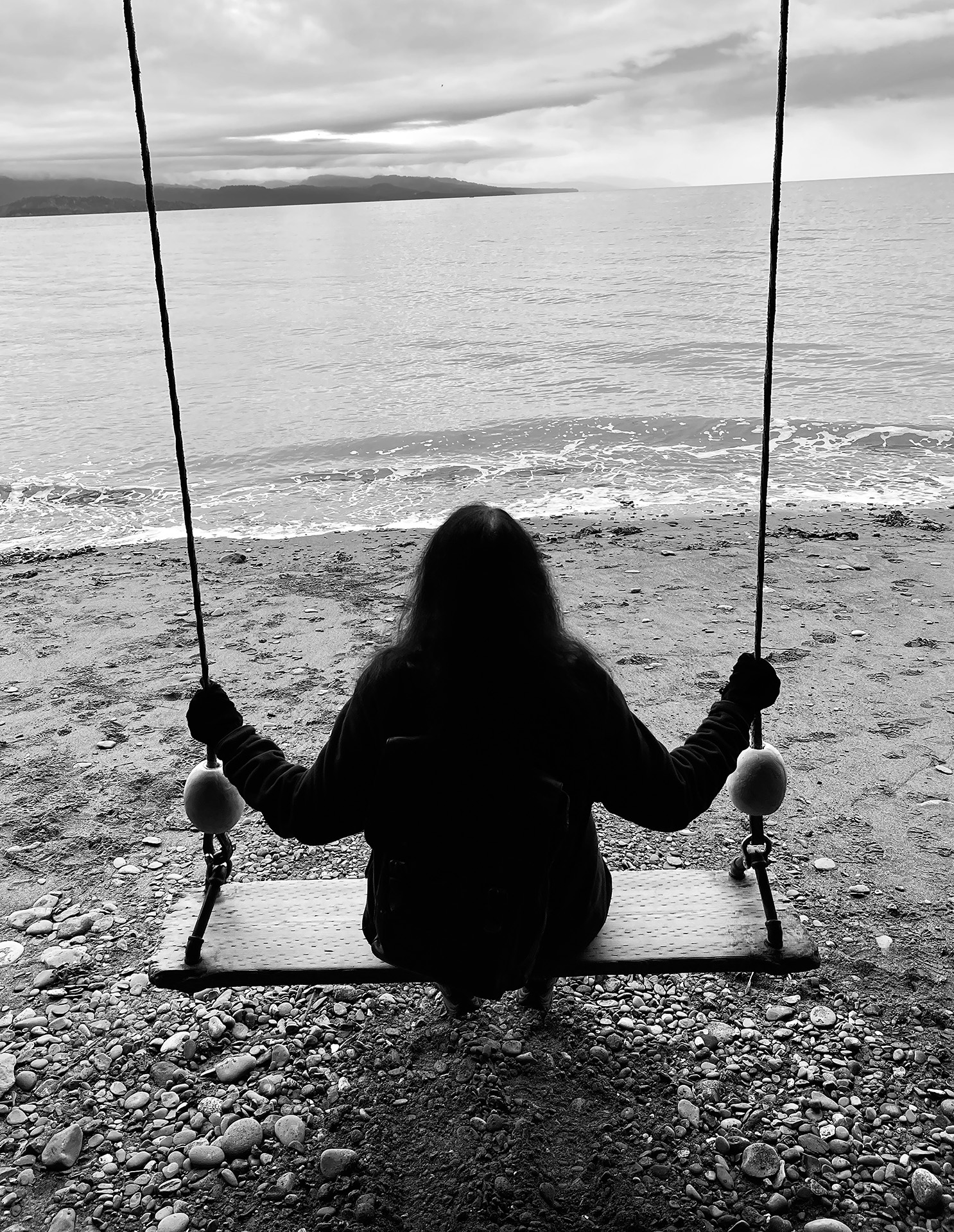 Angie on swing. Homer Spit, AK