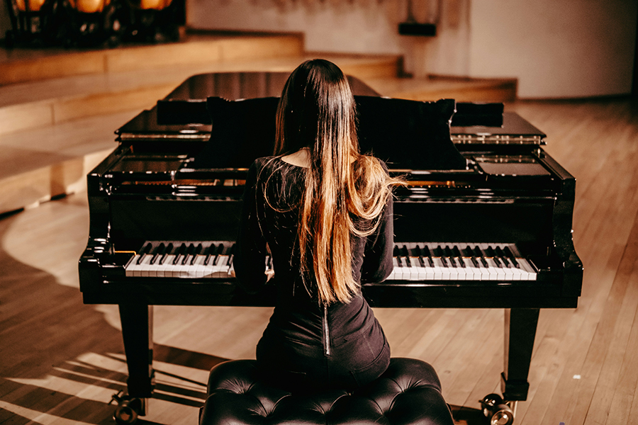 Woman practicing the piano.
