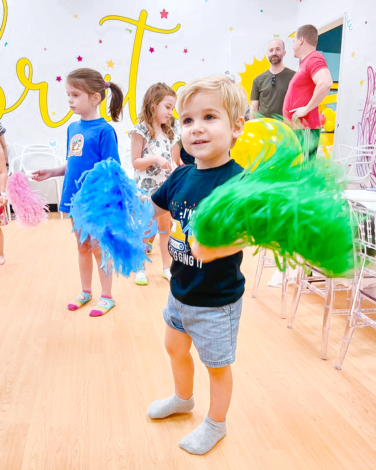 Smiling child playing safely in our indoor playground in [CITY]