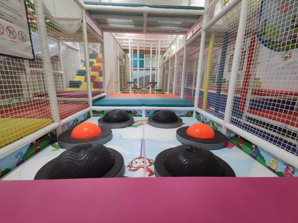 Older kids playing on multi-level structures