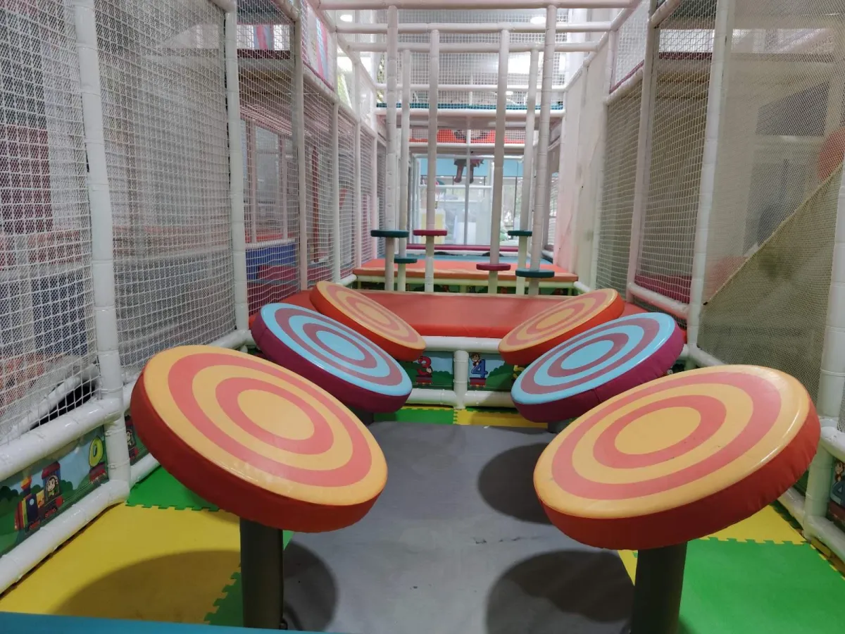 Children enjoying the multi-level indoor playground at Cheeky Monkeys