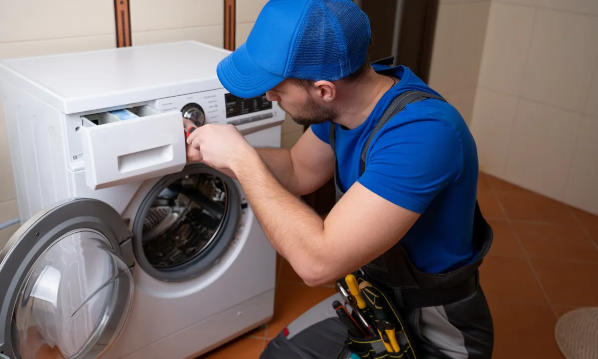 Technician installing a brand new washer machine in Alexandria, VA