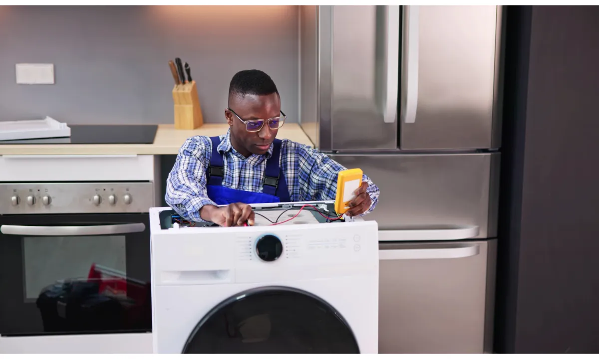 a technician installing brand new washing machine