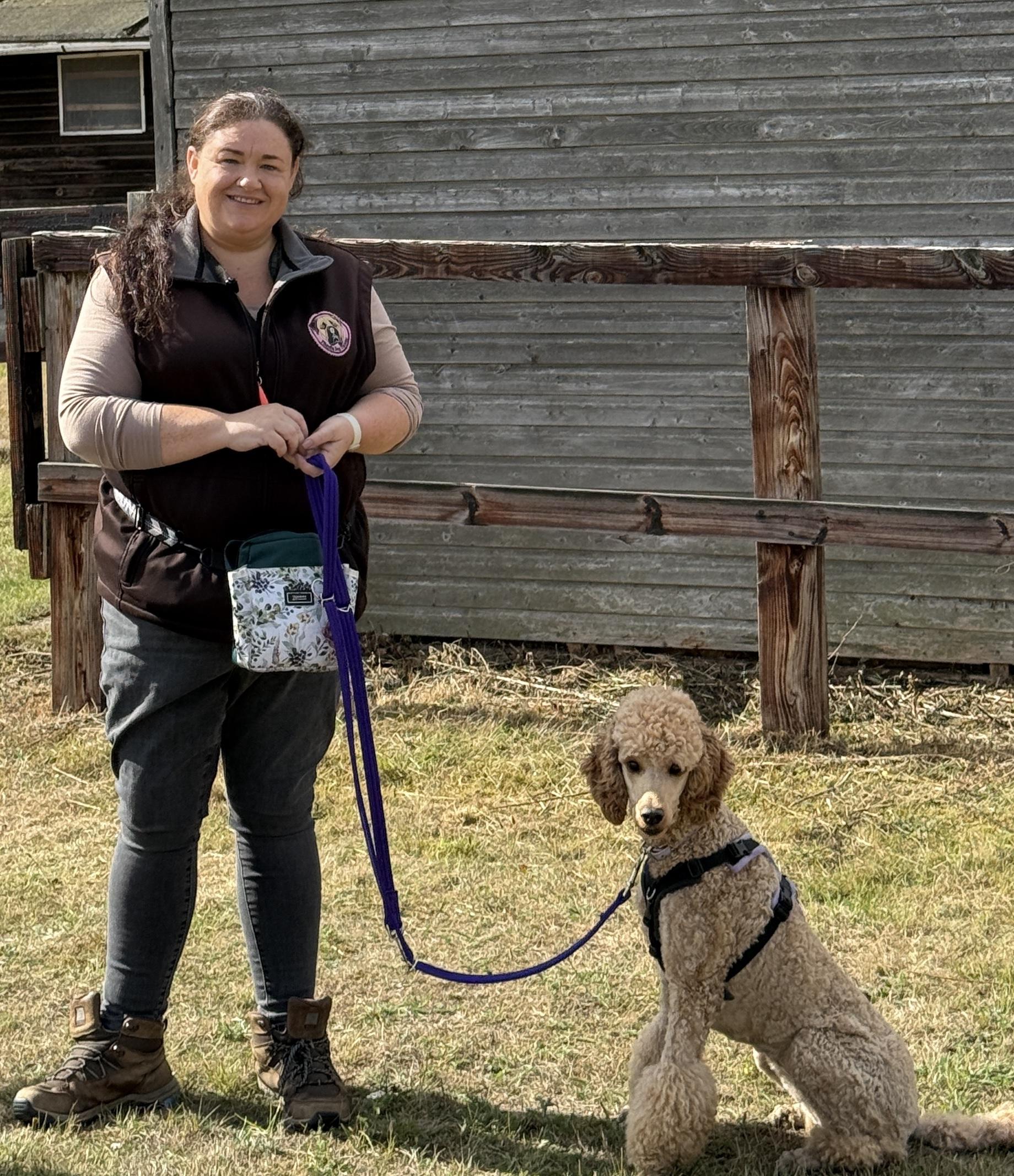 Soft-focus heartwarming portrait of Jolene interacting gently with a dog