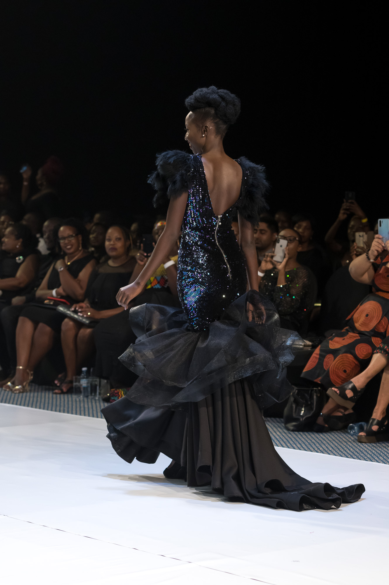 Young woman in traditional attire with headscarf.