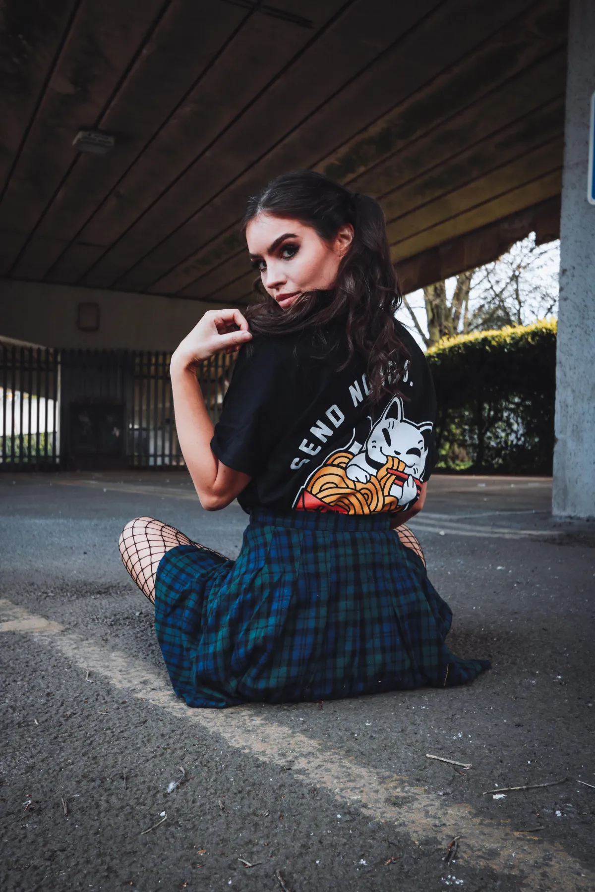 woman holding clear glass candle holder and grayscale portrait of a woman