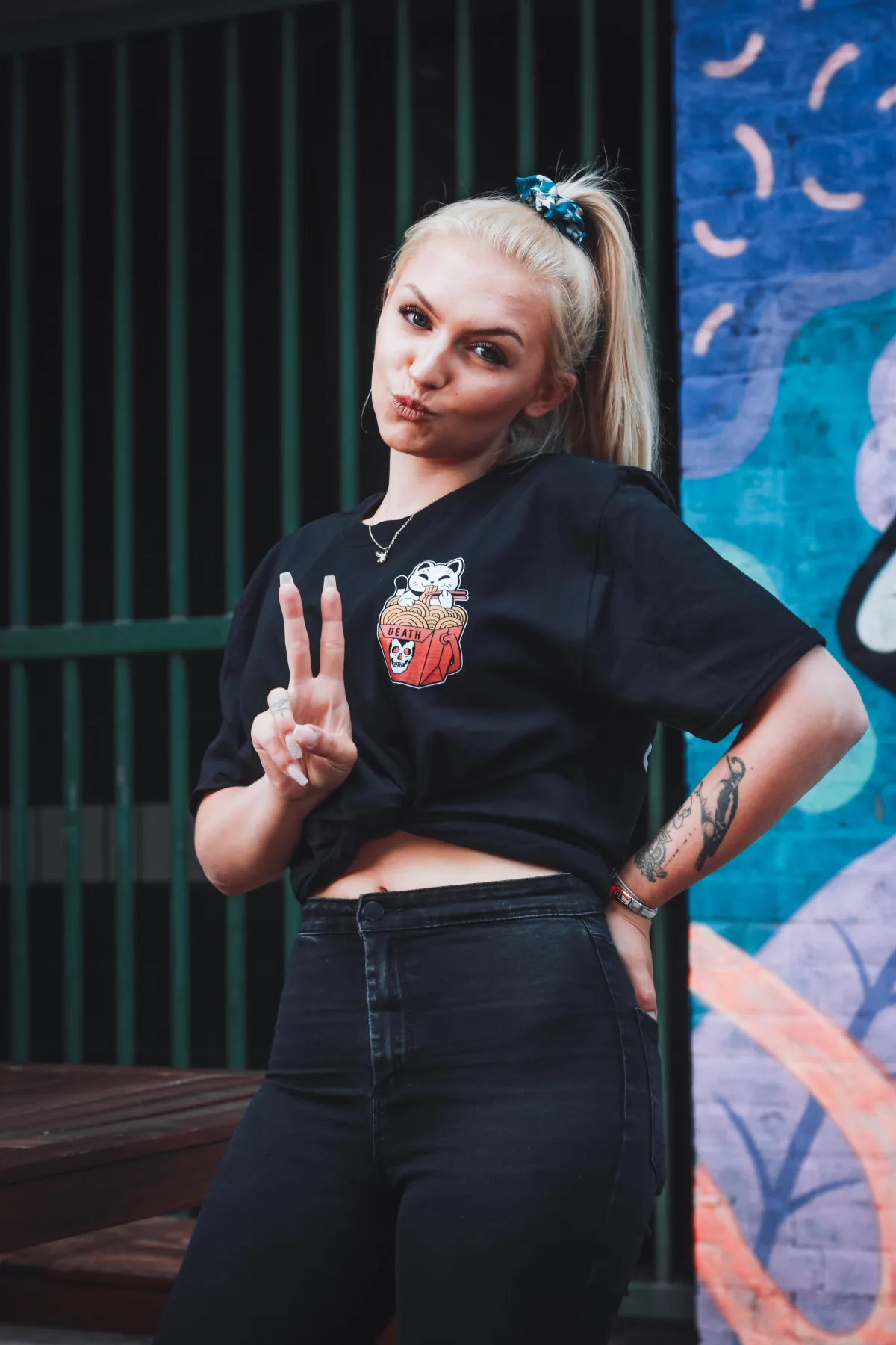 woman holding clear glass candle holder and grayscale portrait of a woman