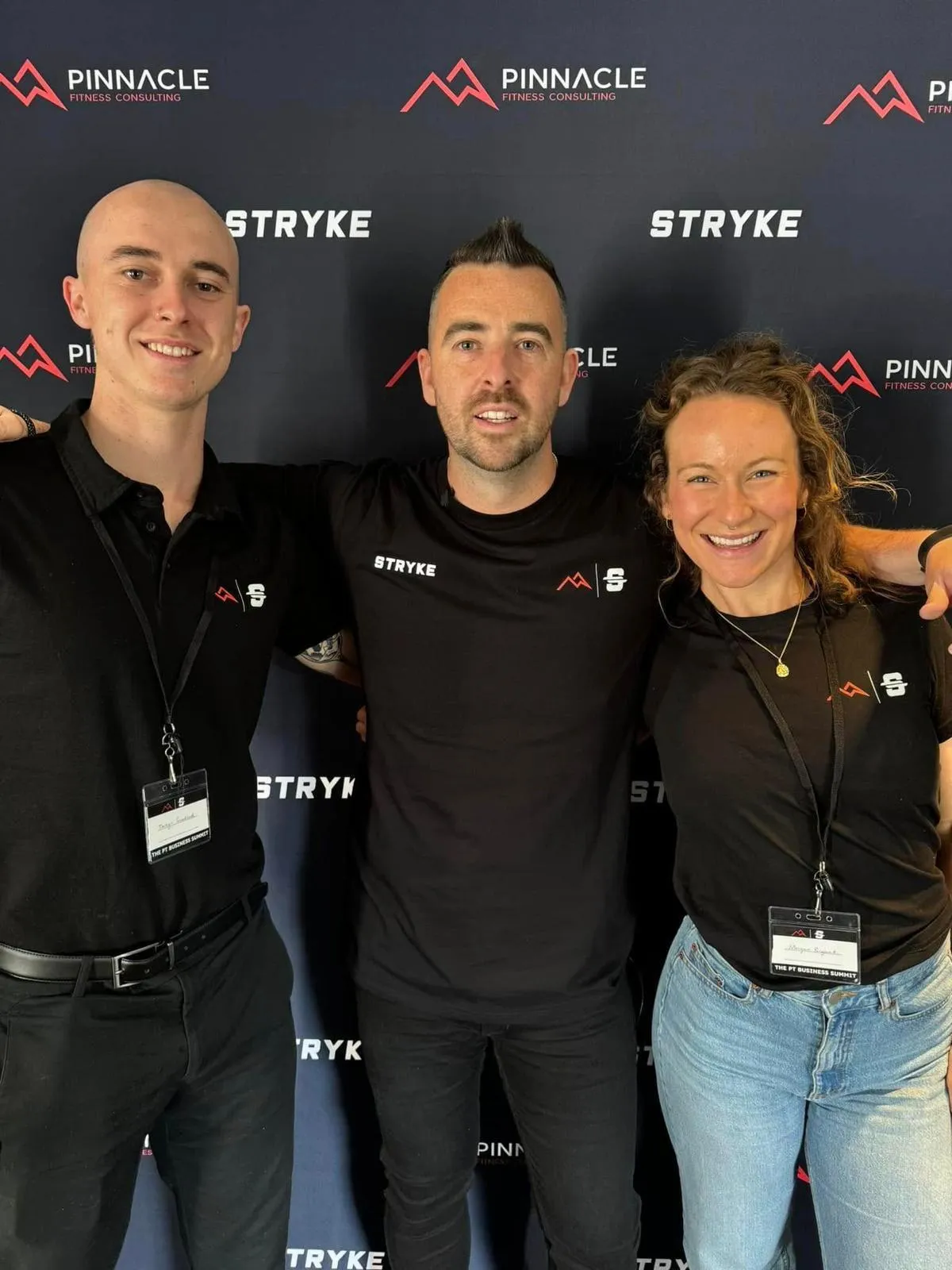 Cyclists in a race wearing colorful jerseys and helmets.