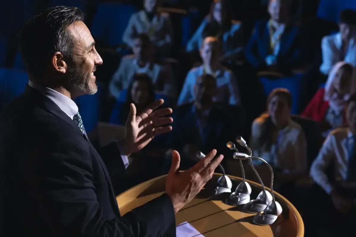 Young people ask questions during a presentation.
