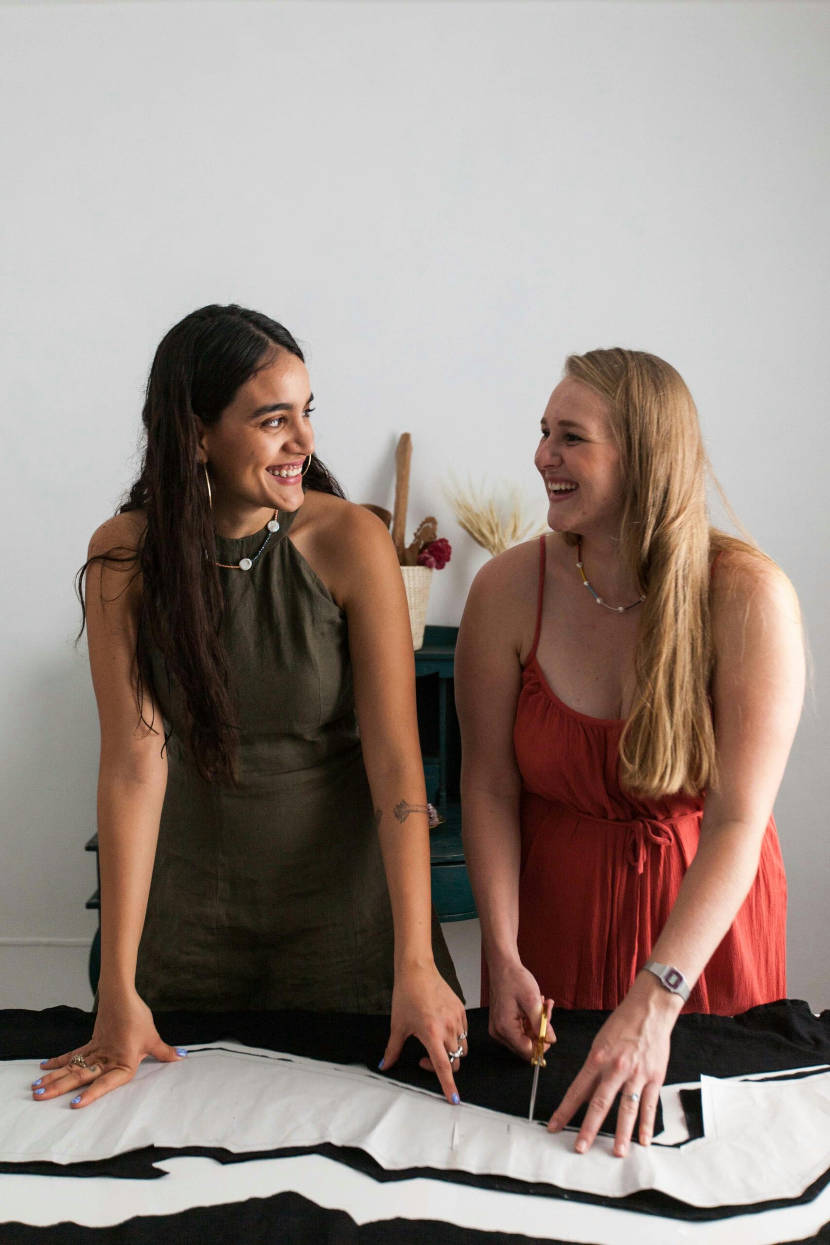 Two smiling makers preparing handmade products