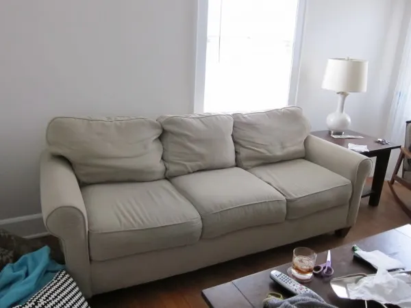 Consider reupholstering second-hand sofas to make them look new again.