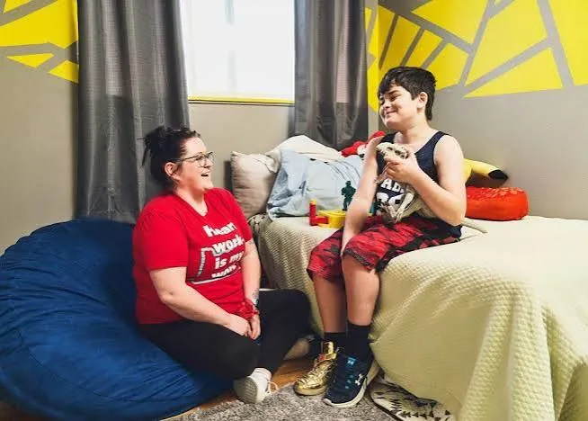 Care professional supporting a person in a home setting